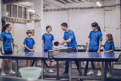 Group of table tennis players,mixed age table tennis training