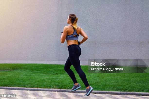 Young Beautiful Sportive Girl Runing View From The Back Stock Photo - Download Image Now