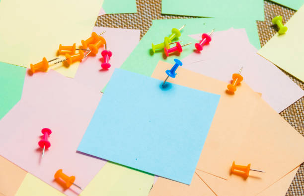 istock Stationary, Pushpins Heap on Blank Colored Sticker. Time-management, Planning. 936129860