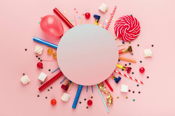 Children birthday party background Children birthday party background, frame with sweets, lollipops and confetti on pink background, copy space, top view carnival celebration event photos stock pictures, royalty-free photos & images