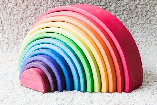 istock wooden waldorf rainbow on white carpet 936136984