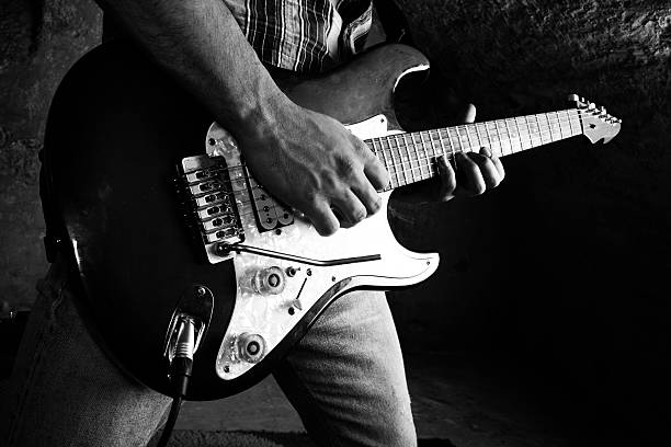 istock Black and white photo of elecrical guitarist 93613792
