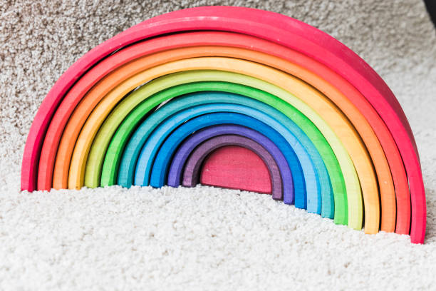 istock wooden waldorf rainbow on white carpet 936138288