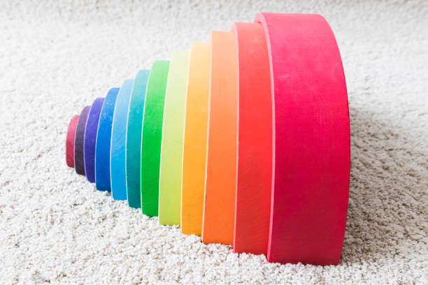 istock wooden waldorf rainbow on white carpet 936139874