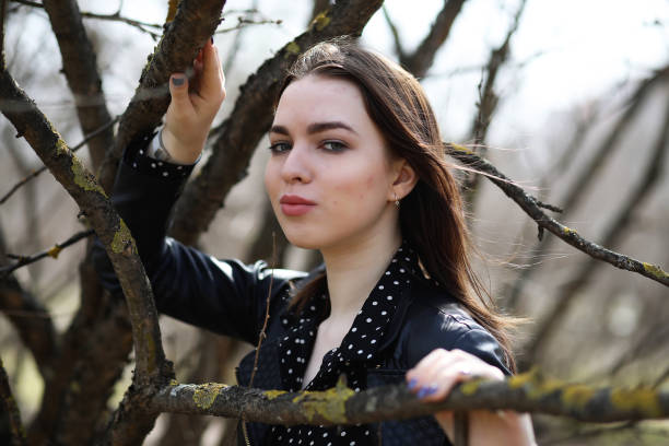 istock Girl on a walk through the spring city 936139956