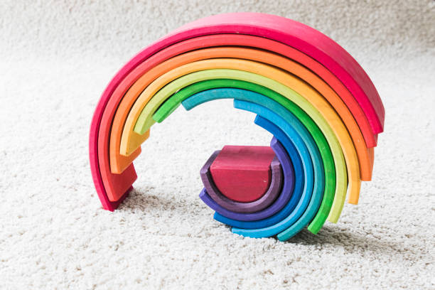 istock wooden waldorf rainbow on white carpet 936140500