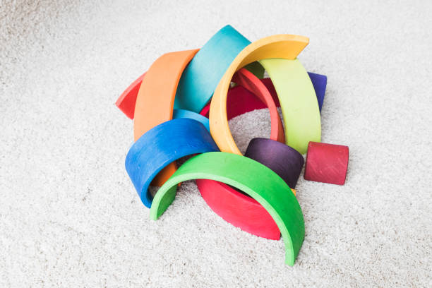 istock wooden waldorf rainbow on white carpet 936142928