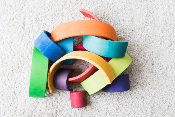 istock wooden waldorf rainbow on white carpet 936143048