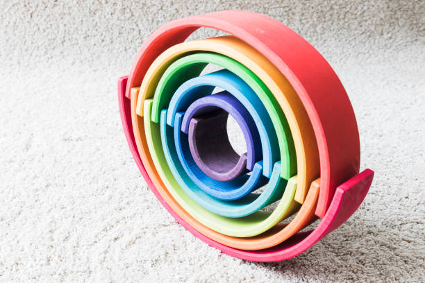 istock wooden waldorf rainbow on white carpet 936143352