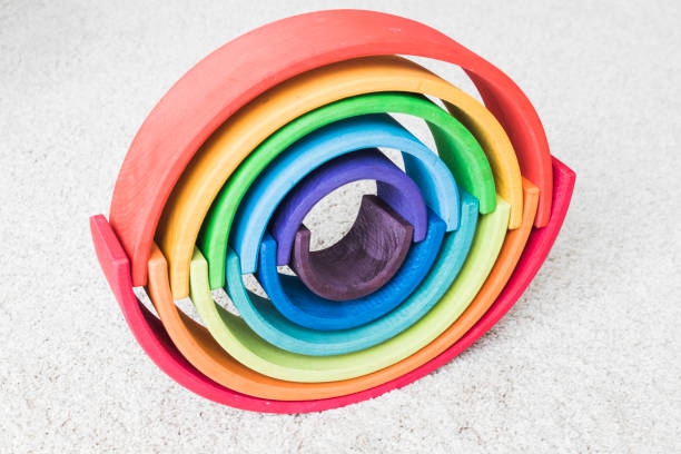wooden waldorf rainbow on white carpet