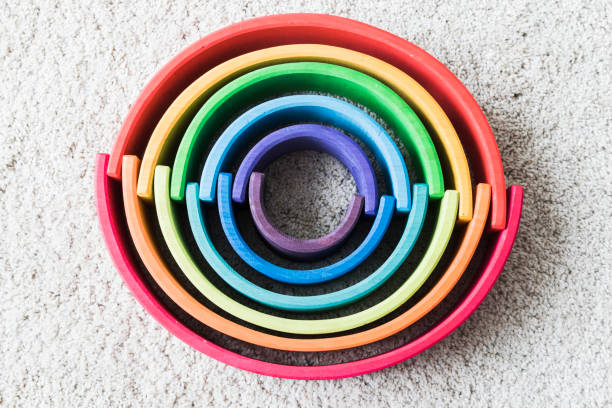 istock wooden waldorf rainbow on white carpet 936143470