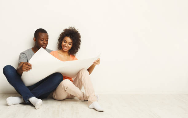 istock Black sitting on floor in new apartment 936144906