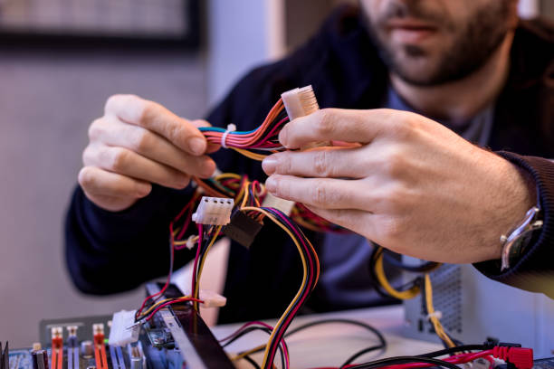 istock cropped image of man holding wires in hands 936148194