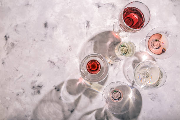 istock Wine tasting concept - glass with different wine on marble background 936148440