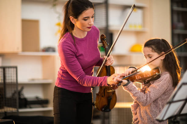 istock Playing the violin with my teacher 936151744