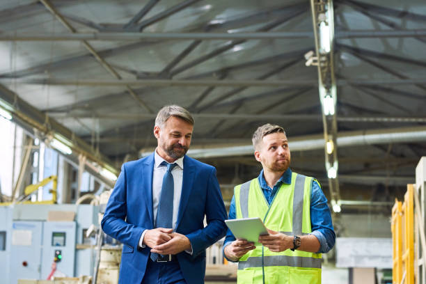 istock Mature Businessman Visiting Factory 936152324