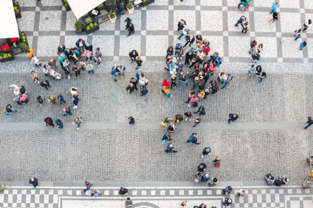 Prague, Сzech Republic - April 06, 2016: View on Old Town Square in Pargue from the Astronomical Clock Tower - tourists in colorful clothes are gathering on the square.