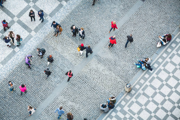 Prague, Сzech Republic - April 06, 2016: View on Old Town Square in Pargue from the Astronomical Clock Tower - tourists in colorful clothes are gathering on the square.
