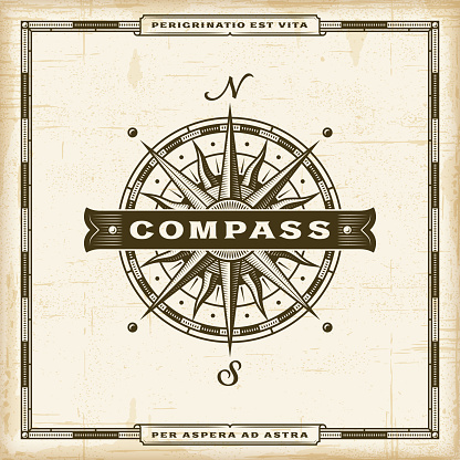 Vintage nautical compass label in retro woodcut style. Editable EPS10 vector illustration with transparency.