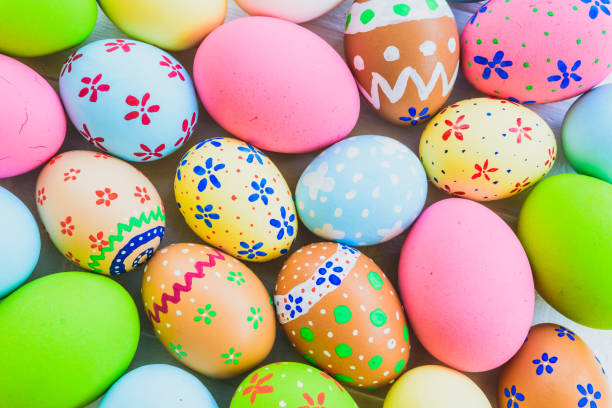 istock Happy easter!  Closeup Colorful Easter eggs background. Happy family preparing for Easter. 936160064