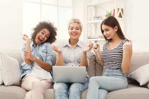 istock Three beautiful women using laptop at home 936166134