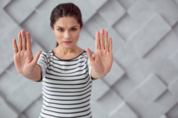 istock Nice young woman saying stop 936166620