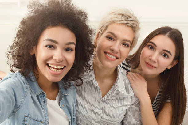 istock Happy friends taking selfie at home 936166688