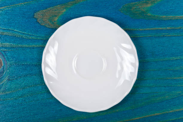 istock A white dessert plate on wood 936171012