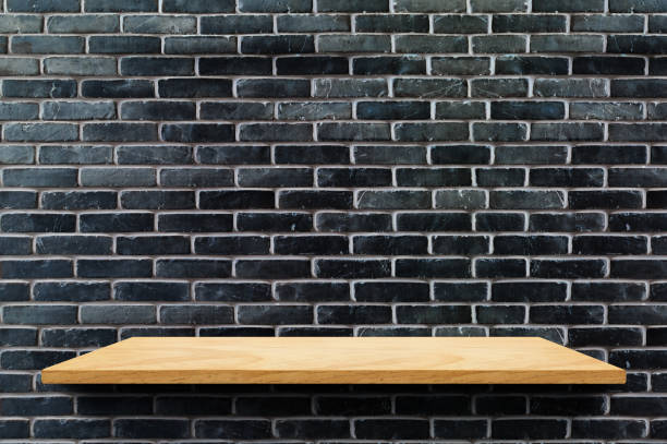 istock Empty wood board shelf at black brick wall background,Mock up for display or montage of product or design 936172102
