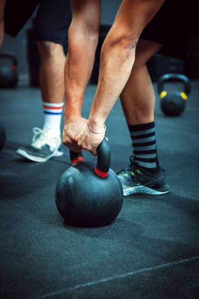 istock Gym fitness - Men Workout Kettlebell 936176486