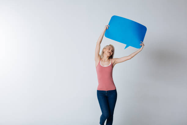 istock Cheerful joyful woman holding a message sign 936176738