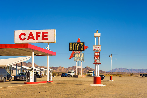 Amboy, California, USA - December 27, 2017 : Roy's motel and cafe with vintage neon sign on historic Route 66 in the Mojave desert.