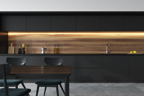 istock Front view of a black and wooden kitchen, table 936183124