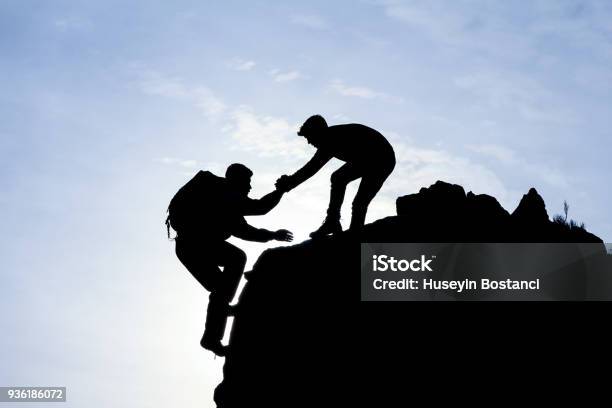 Mountaineering Help Concept Stock Photo - Download Image Now - A Helping Hand, Assistance, Rock Climbing