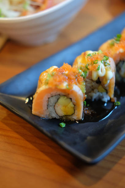 istock Grilled salmon fish sushi on black dish in restaurant 936186168