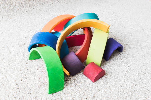 wooden waldorf rainbow on white carpet