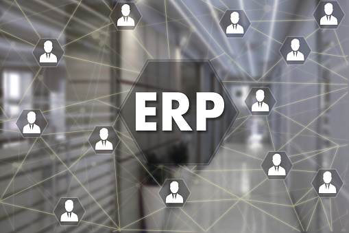 Enterprise Resource Planning. ERP  on the touch screen with a blur background of the office.The concept of Enterprise Resource Planning, ERP