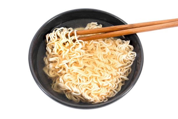 istock Noodle in bowl with bamboo chopsticks isolated on white background 936194104