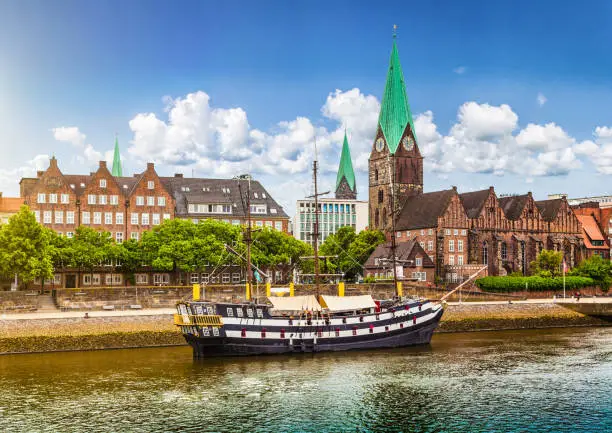 Historic town of Bremen with old sailing ship on Weser river, Germany