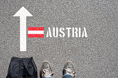 A man with a suitcase travels to Austria