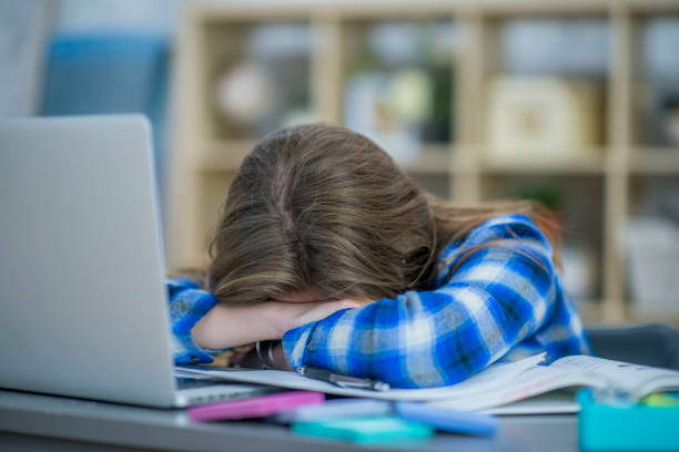 istock Overworked Teen at her Desk 936205832