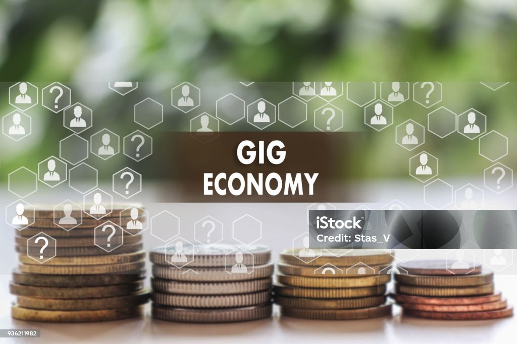 ぼかし金融背景を持つタッチ スクリーン上のギグの経済。ギグ経済概念 - ギグ・エコノミーのロイヤリティフリーストックフォト