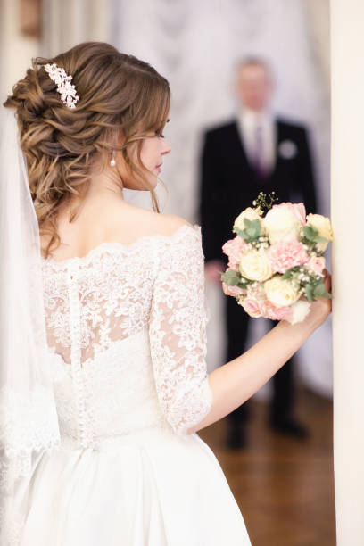istock portrait of the bride. Groom is blurred 936212620