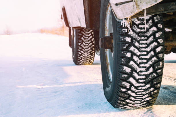 istock Studded winter car tires 936223420