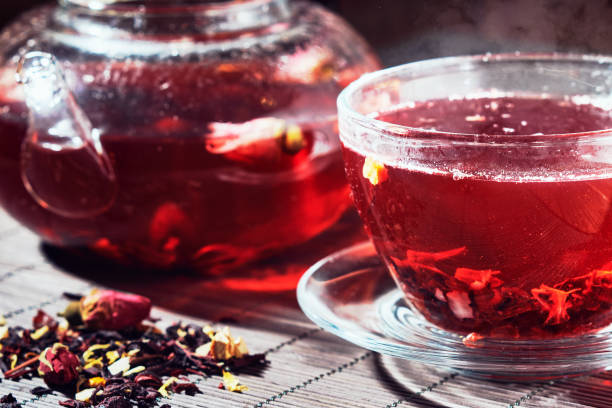 istock Fresh herbal tea in a glass teapot and a cup 936237606