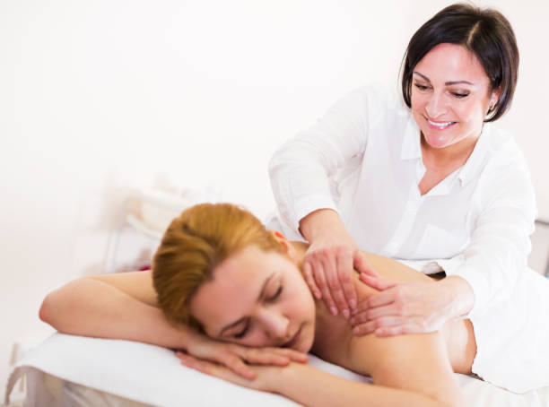 istock Adult masseuse working in salon 936237816