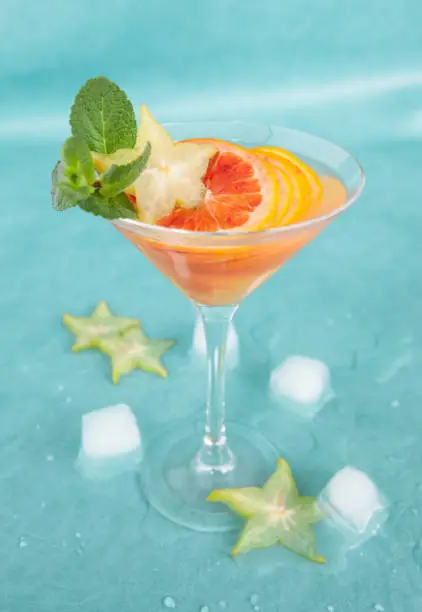 Cold cocktail with fresh bloodoranges and mint leaves