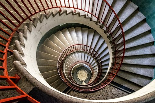 Spiral staircase with red railing