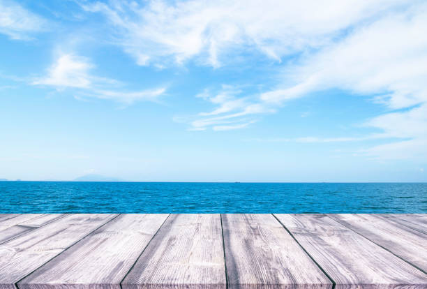 istock Wooden table with seascape background 936258186
