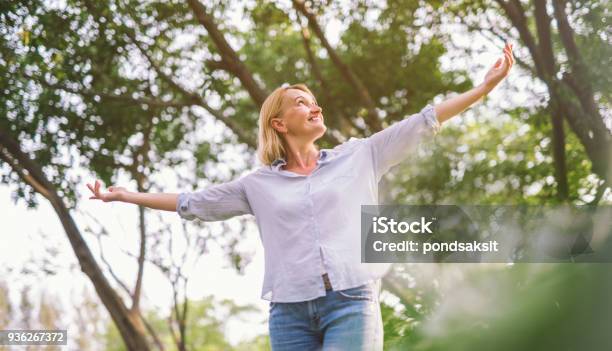 Happy Woman Open Arms With Freedom Relax Stock Photo - Download Image Now - Women, Mature Women, One Woman Only